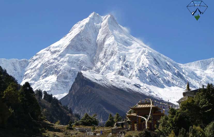 Manaslu Mountain and a Buddhist gompa viewed from Lho village during the Manaslu Circuit Trek in Nepal