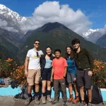 Trekkers walking through Chhomrong village on the Annapurna Base Camp Trek 5 Days