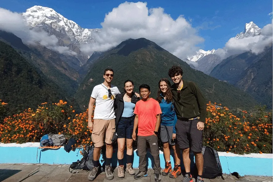 Trekkers walking through Chhomrong village on the Annapurna Base Camp Trek 5 Days