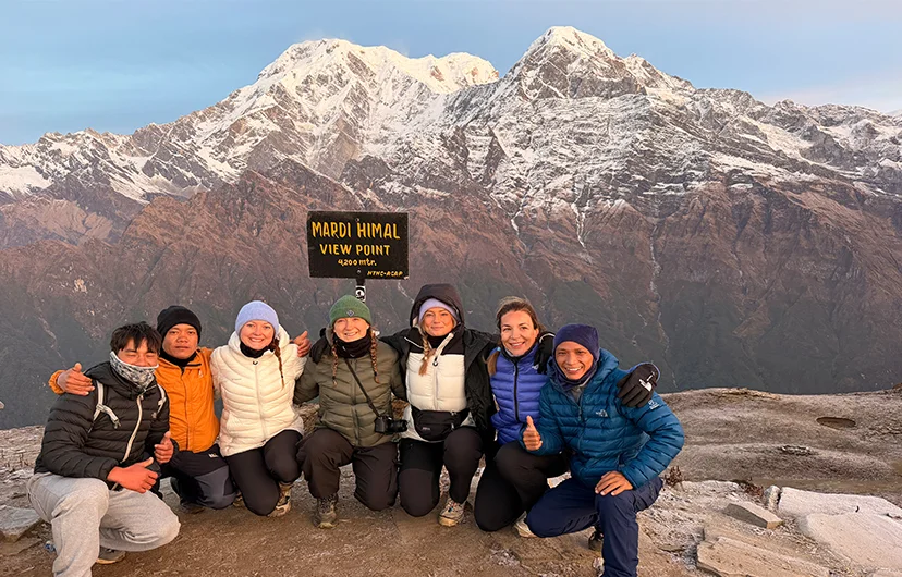 Mardi Himal Viewpoint signboard with Annapurna South and Hiunchuli mountains in the background, Annapurna region, Nepal.